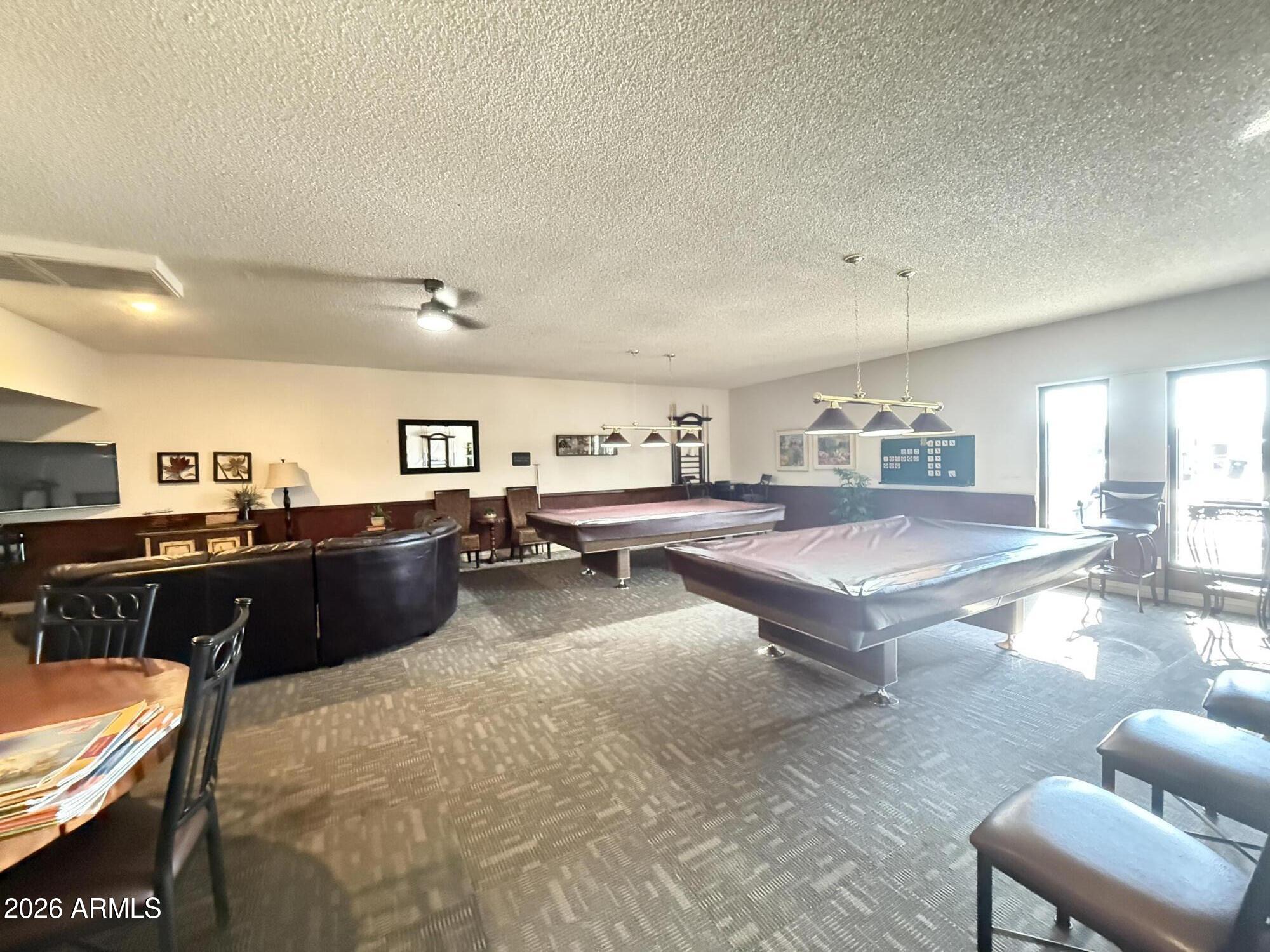 535 South Alma School Road, Unit 113 Mesa, AZ 85210 - Photo 34 of 41 a living room with lots of furniture and kitchen view