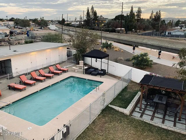 a view of swimming pool with outdoor seating