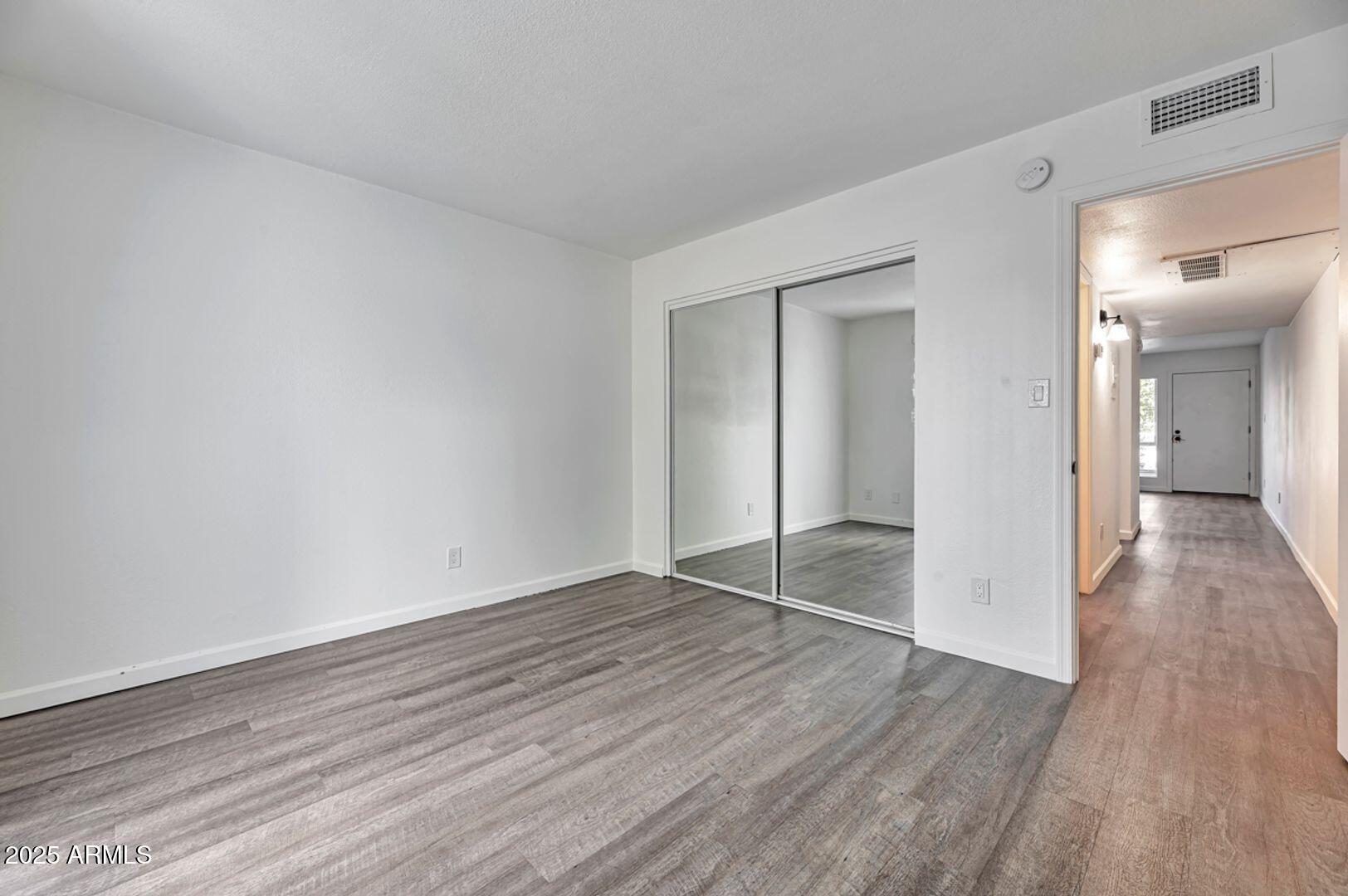 4231 North 13th Place, Unit 110 Phoenix, AZ 85014 - Photo 6 of 9 wooden floor in an empty room