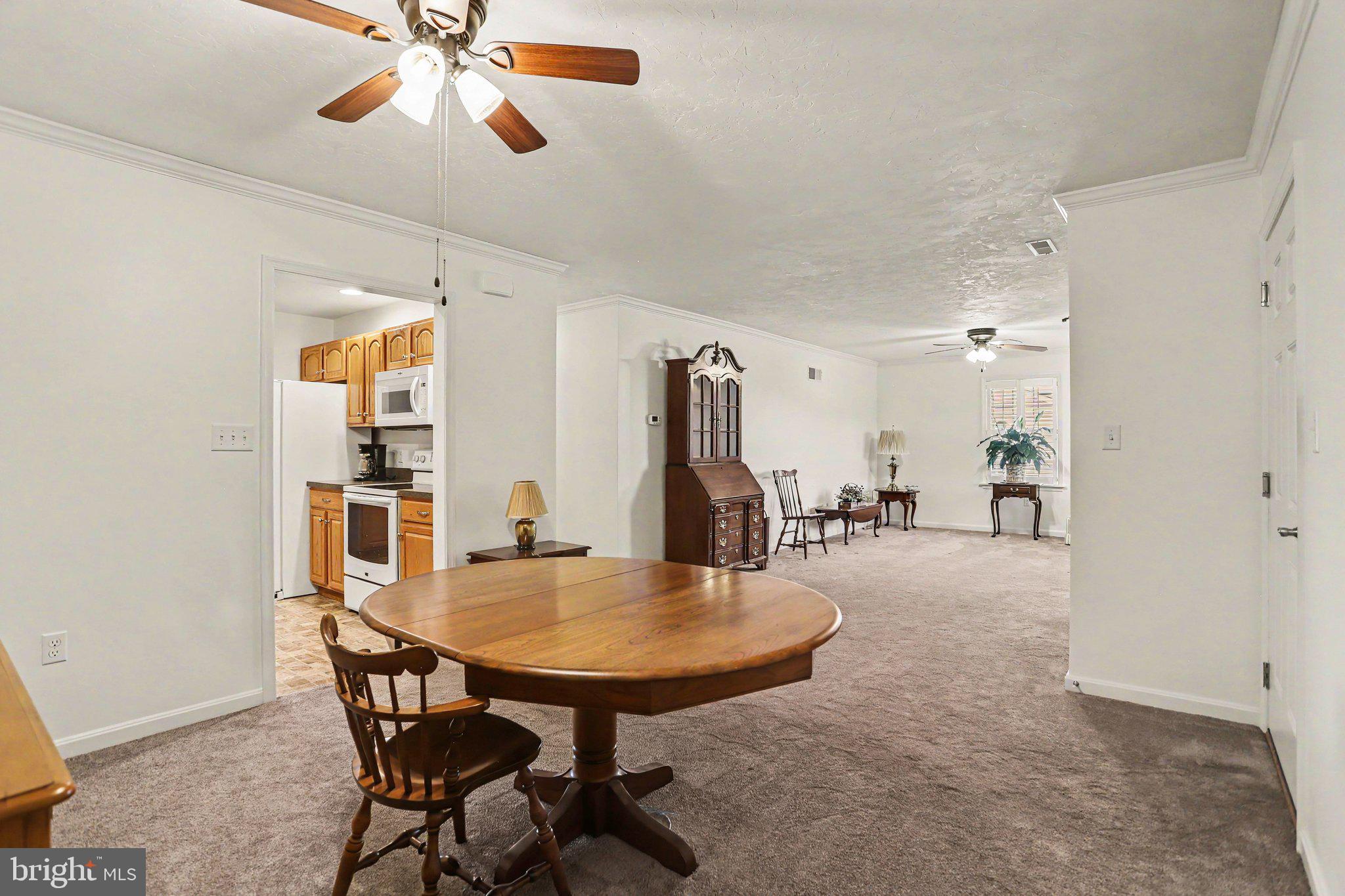 1371 Chami Drive, Unit 166 Spring Grove, PA 17362 - Photo 10 of 28 a dining room with furniture and window