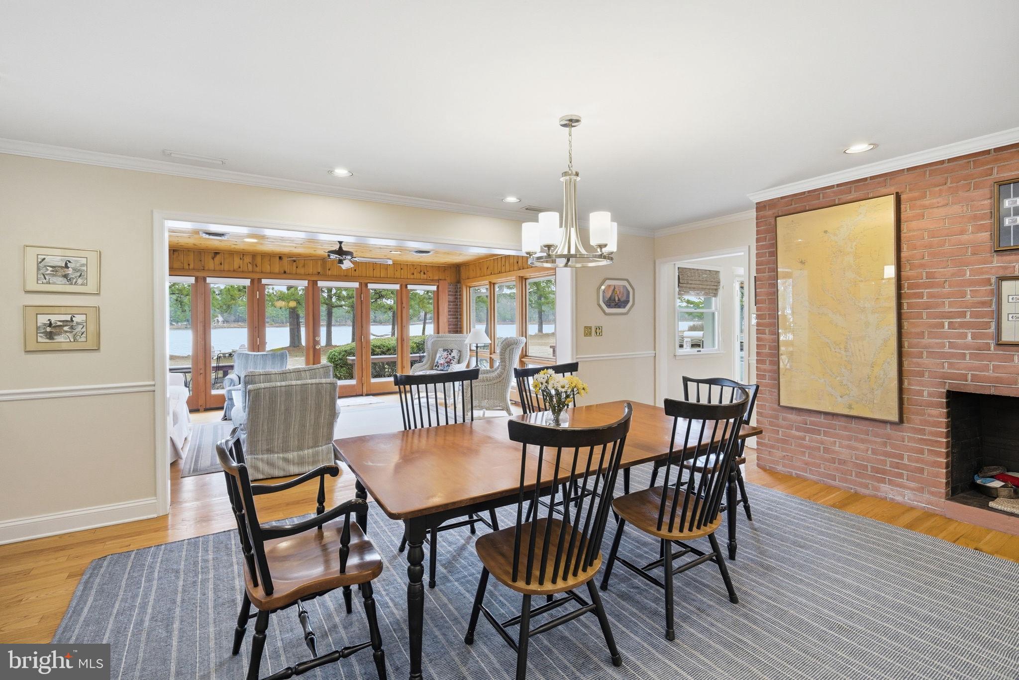 7149 Drum Point Road St. Michaels, MD 21663 - Photo 15 of 71 DINING OVERLOOKING SUNROOM