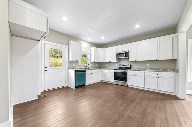 a view of an empty room with a window