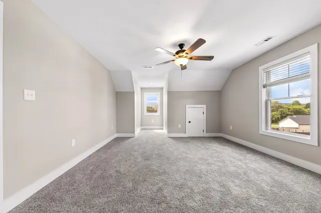 a bathroom with a shower sink and mirror