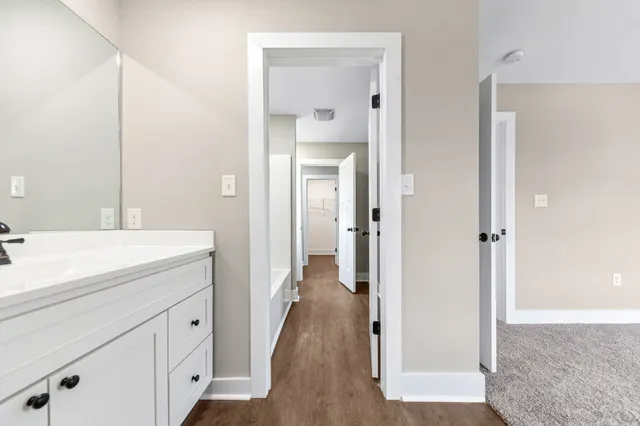 a bathroom with a bathtub a toilet and a shower