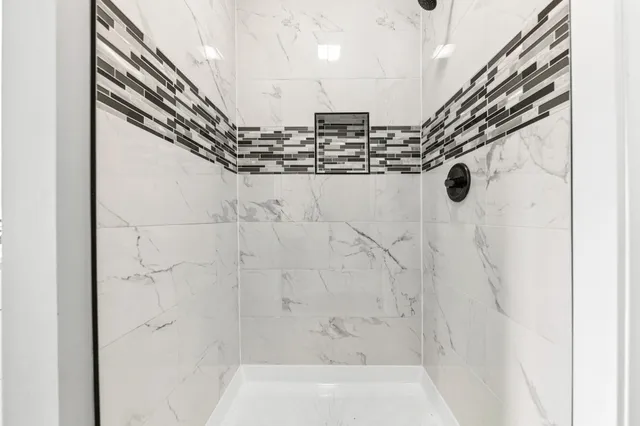 a view of a bathroom from a hallway