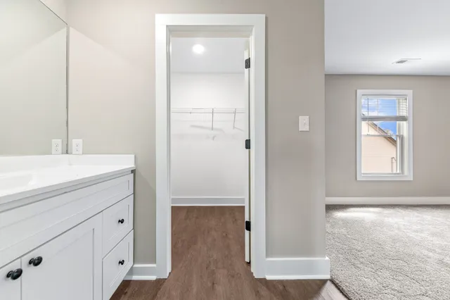 a room with a window and a shower