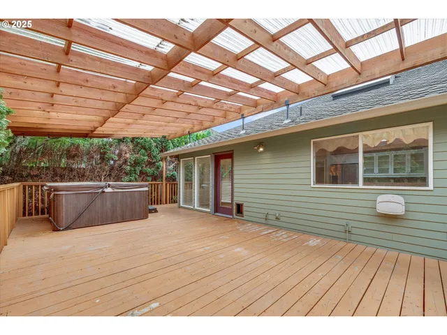 a view of a house with wooden deck