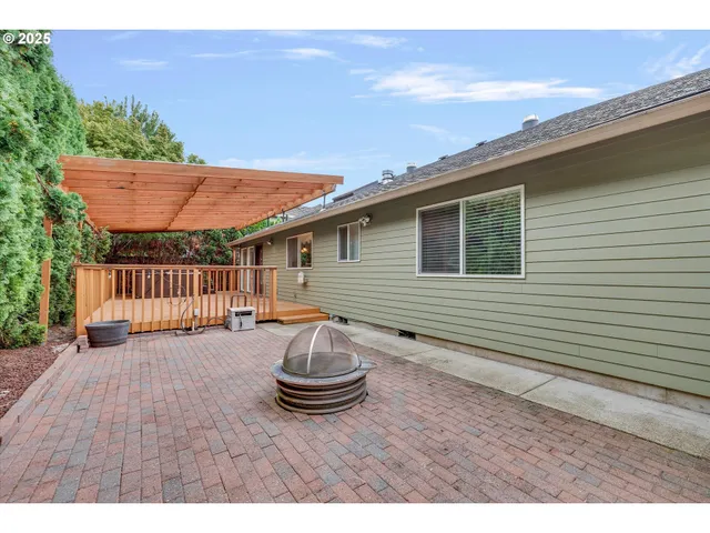 a view of a patio with wooden fence