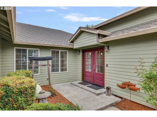 a front view of a house with a garden