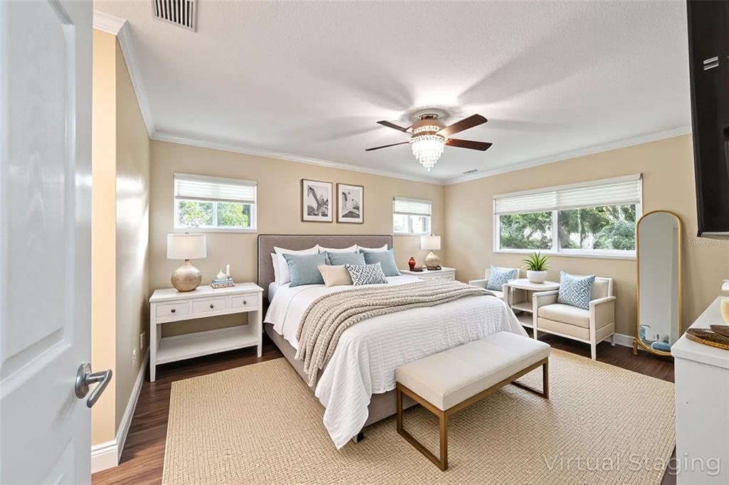 9068 Southwest 82nd Terrace, Unit A Ocala, FL 34481 - Photo 12 of 30 a spacious bedroom with a bed a couch and a large window with the outer view