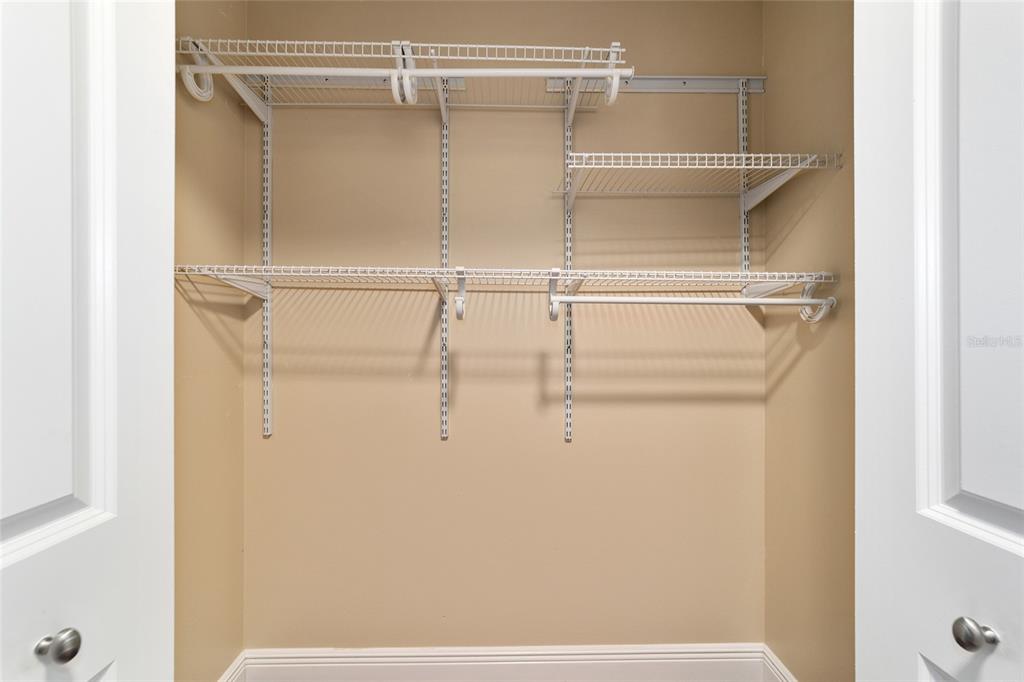 9068 Southwest 82nd Terrace, Unit A Ocala, FL 34481 - Photo 17 of 30 a view of a room with racks on the wall