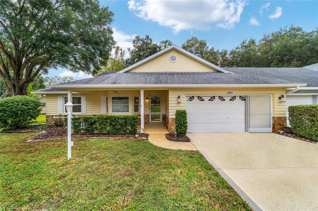 9068 Southwest 82nd Terrace, Unit A Ocala, FL 34481 - Photo 26 of 30 front view of a house with a yard