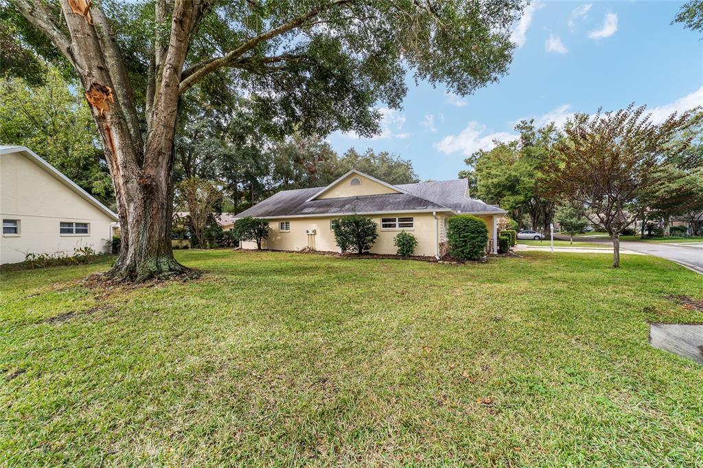9068 Southwest 82nd Terrace, Unit A Ocala, FL 34481 - Photo 4 of 30 a front view of a house with a yard