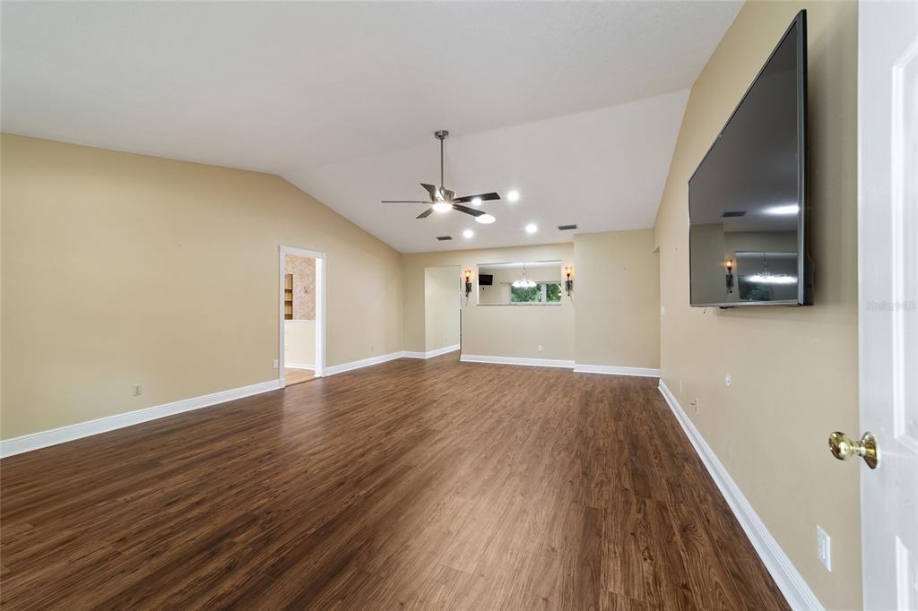 9068 Southwest 82nd Terrace, Unit A Ocala, FL 34481 - Photo 6 of 30 wooden floor in an empty room with a window