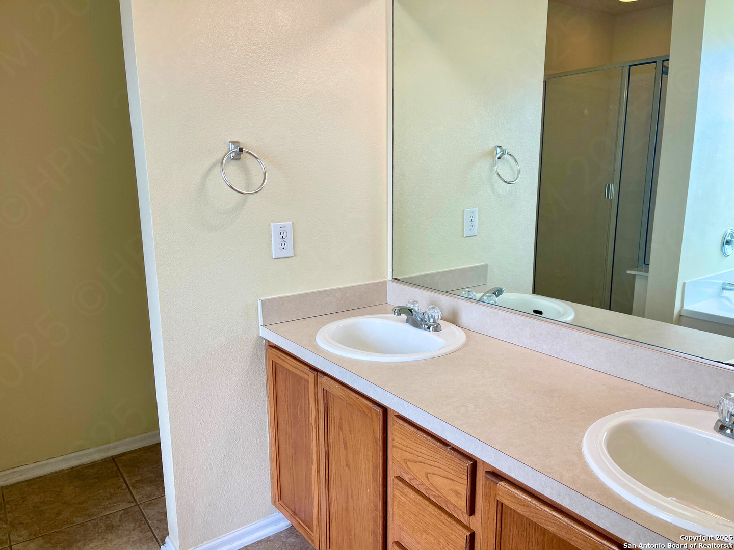9523 Ascending Port Converse, TX 78109 - Photo 11 of 18 a bathroom with a sink and a mirror