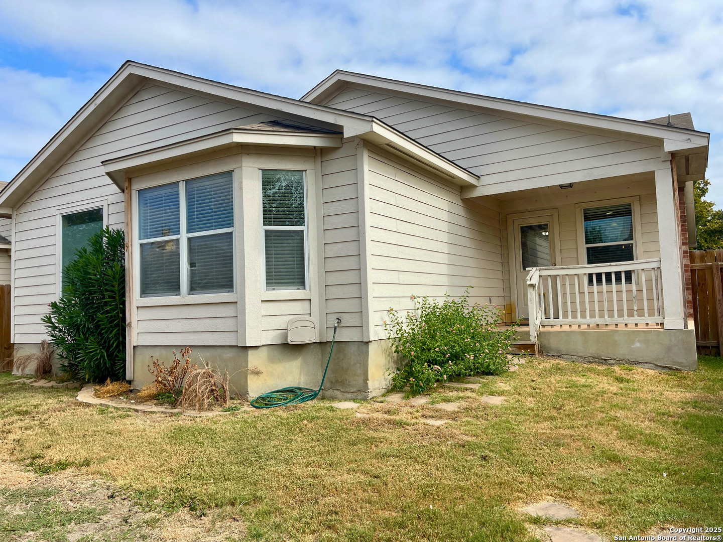 9523 Ascending Port Converse, TX 78109 - Photo 16 of 18 a front view of a house with a yard