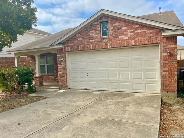 a front view of a house with a garage