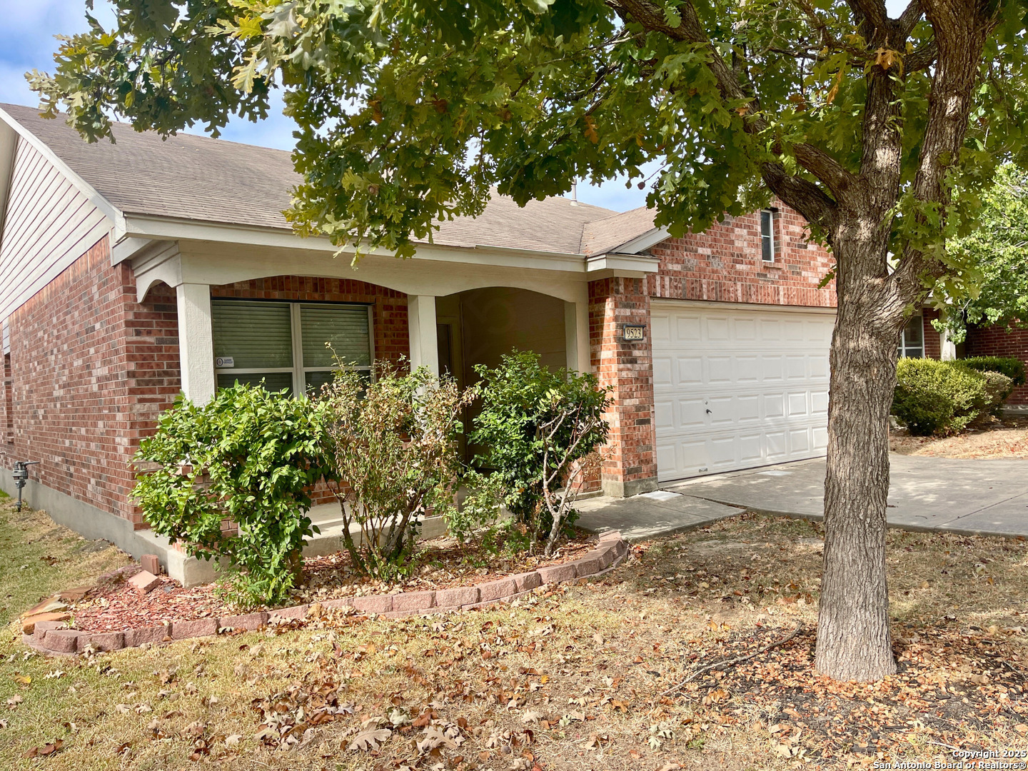 9523 Ascending Port Converse, TX 78109 - Photo 4 of 18 a front view of a house with garden