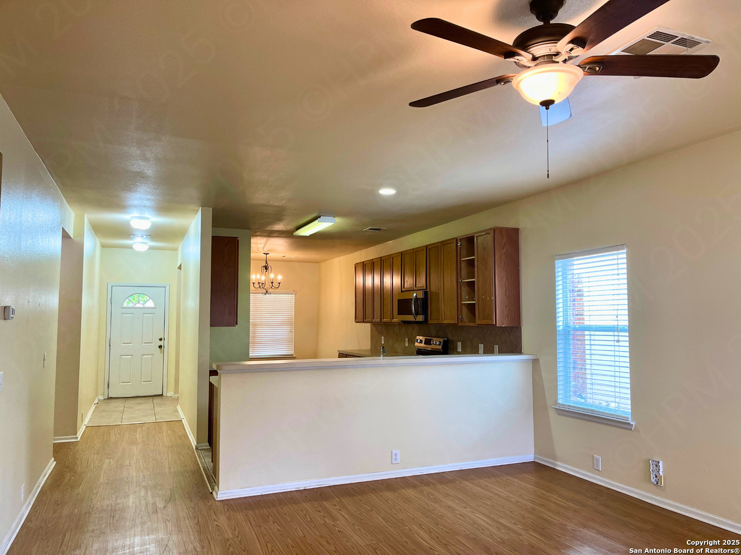 9523 Ascending Port Converse, TX 78109 - Photo 6 of 18 a view of a kitchen with a sink and wooden cabinet