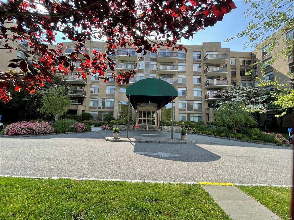 35 North Chatsworth Avenue, Unit 1K Larchmont, NY 10538 - Photo 1 of 23 a view of a patio with a table and chairs under an umbrella