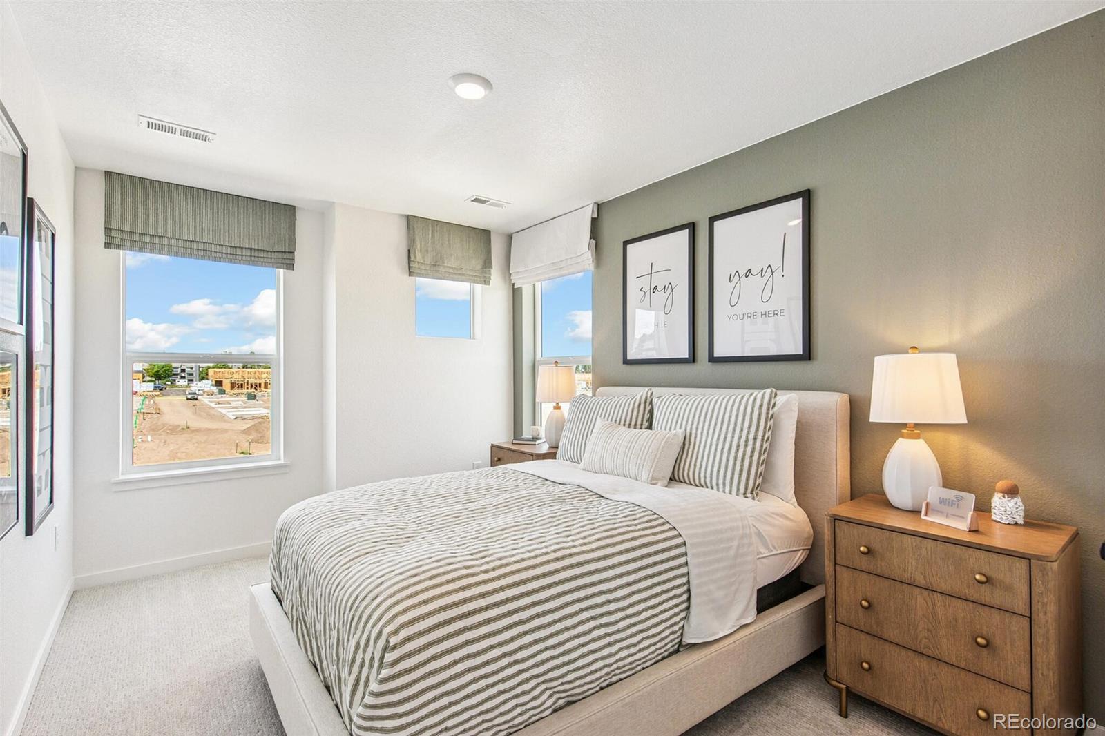 1381 South Chester Street, Unit B Denver, CO 80247 - Photo 14 of 18 a bedroom with a bed and a window