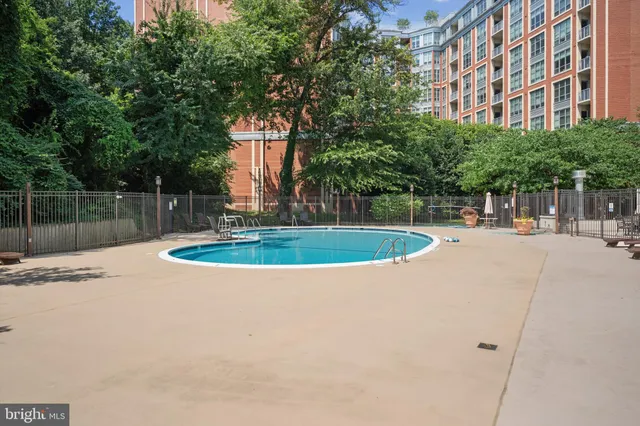 a view of a swimming pool with a patio
