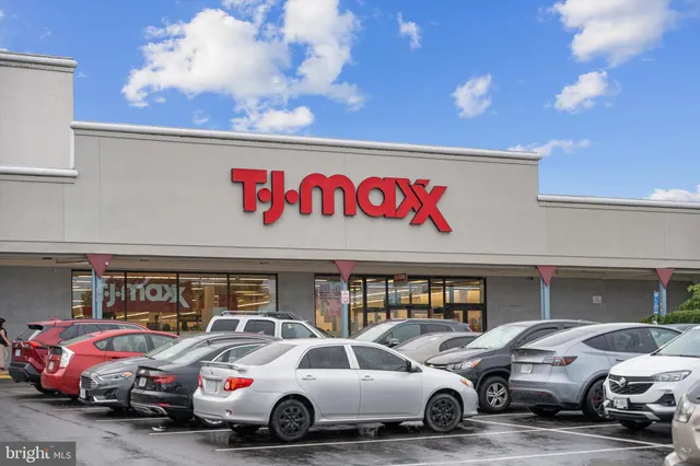 a view of a cars park in front of a building