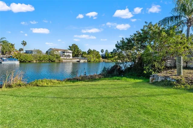 an aerial view of a houses with a lake view