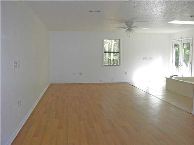 4555 Rainbird Rise Road Crestview, FL 32539 - Photo 12 of 32 an empty room with windows