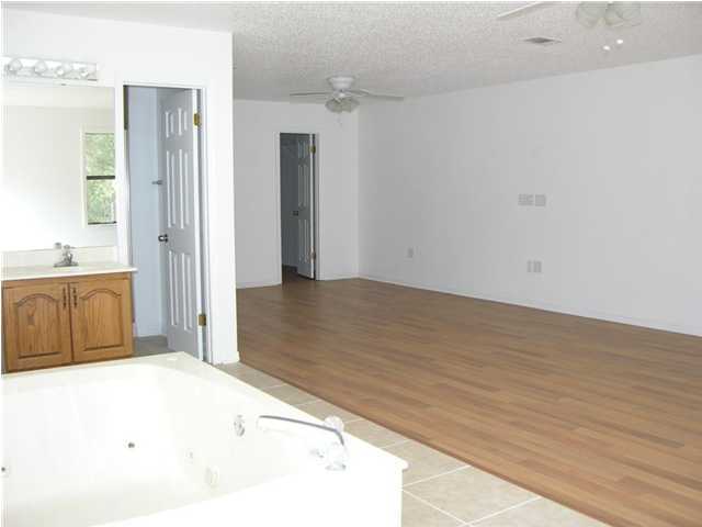 4555 Rainbird Rise Road Crestview, FL 32539 - Photo 13 of 32 a view of a kitchen with a sink and cabinet