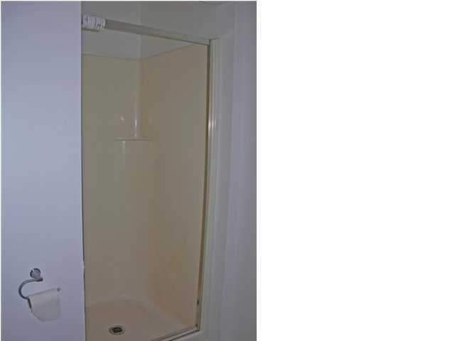 4555 Rainbird Rise Road Crestview, FL 32539 - Photo 17 of 32 a bathroom with a shower