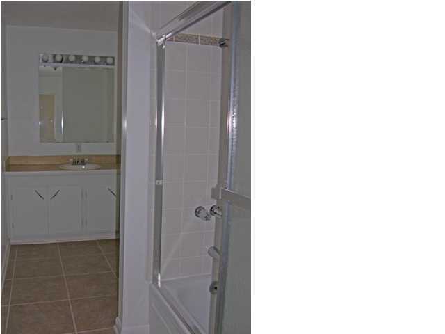 4555 Rainbird Rise Road Crestview, FL 32539 - Photo 18 of 32 a bathroom with a shower and a mirror