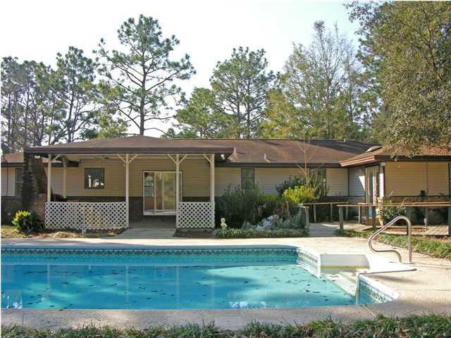 4555 Rainbird Rise Road Crestview, FL 32539 - Photo 25 of 32 front view of a house with a patio