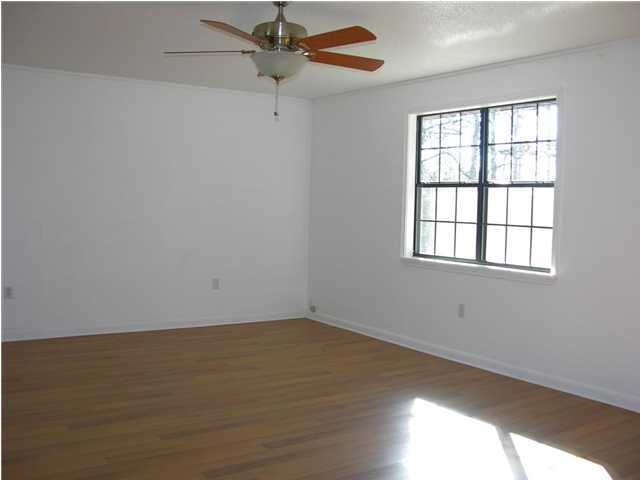 4555 Rainbird Rise Road Crestview, FL 32539 - Photo 32 of 32 wooden floor in an empty room with a window