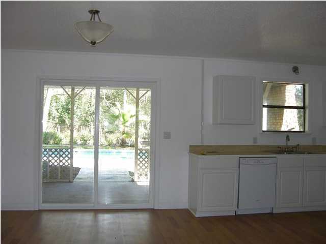 4555 Rainbird Rise Road Crestview, FL 32539 - Photo 5 of 32 a bathroom with a sink and a window