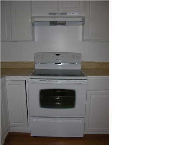4555 Rainbird Rise Road Crestview, FL 32539 - Photo 8 of 32 a stove top oven sitting inside of a kitchen