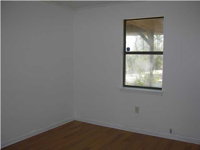 4555 Rainbird Rise Road Crestview, FL 32539 - Photo 9 of 32 an empty room with a window
