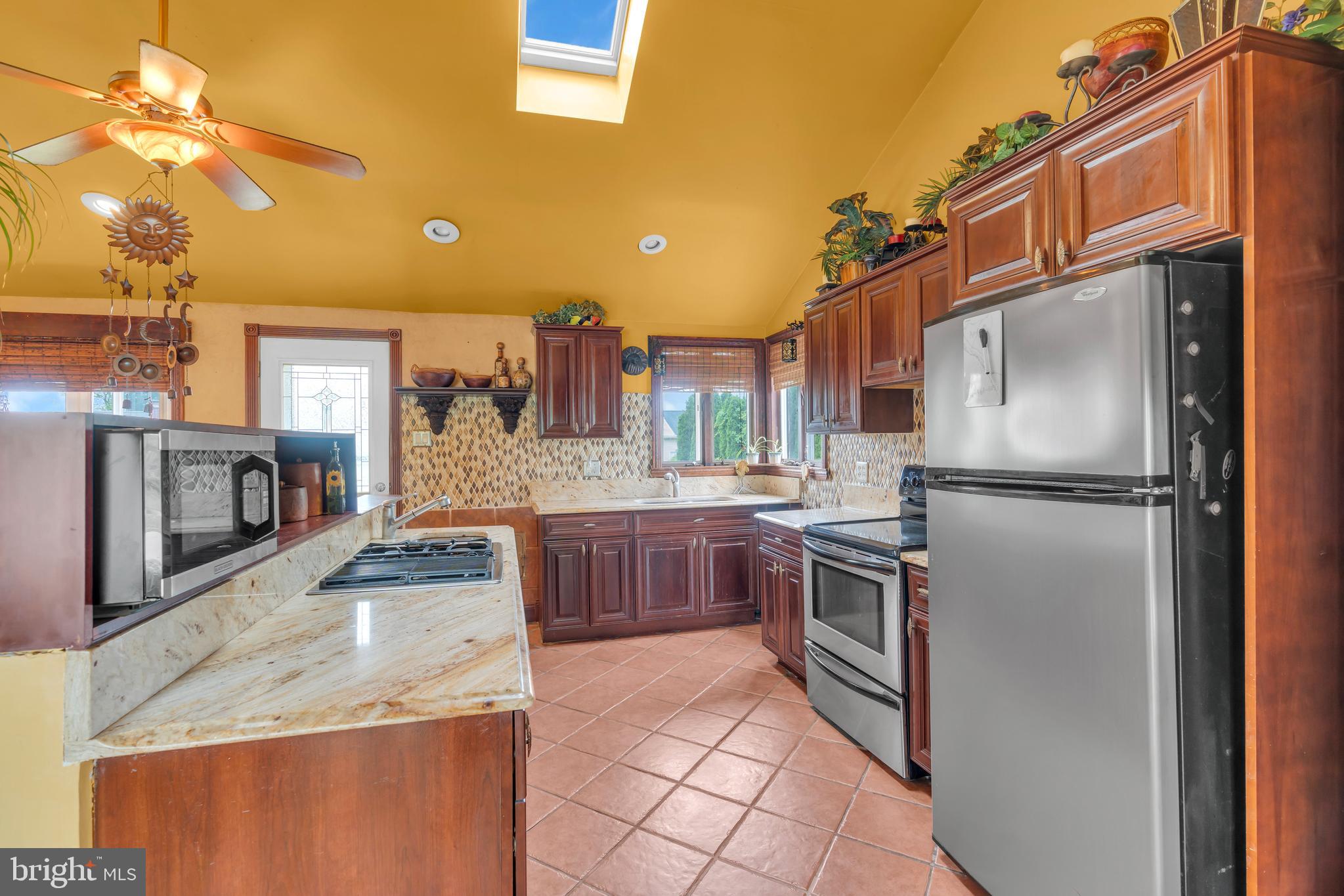 516 River Drive Riverside, NJ 08075 - Photo 12 of 82 a kitchen with stainless steel appliances granite countertop a refrigerator a oven a sink and dishwasher