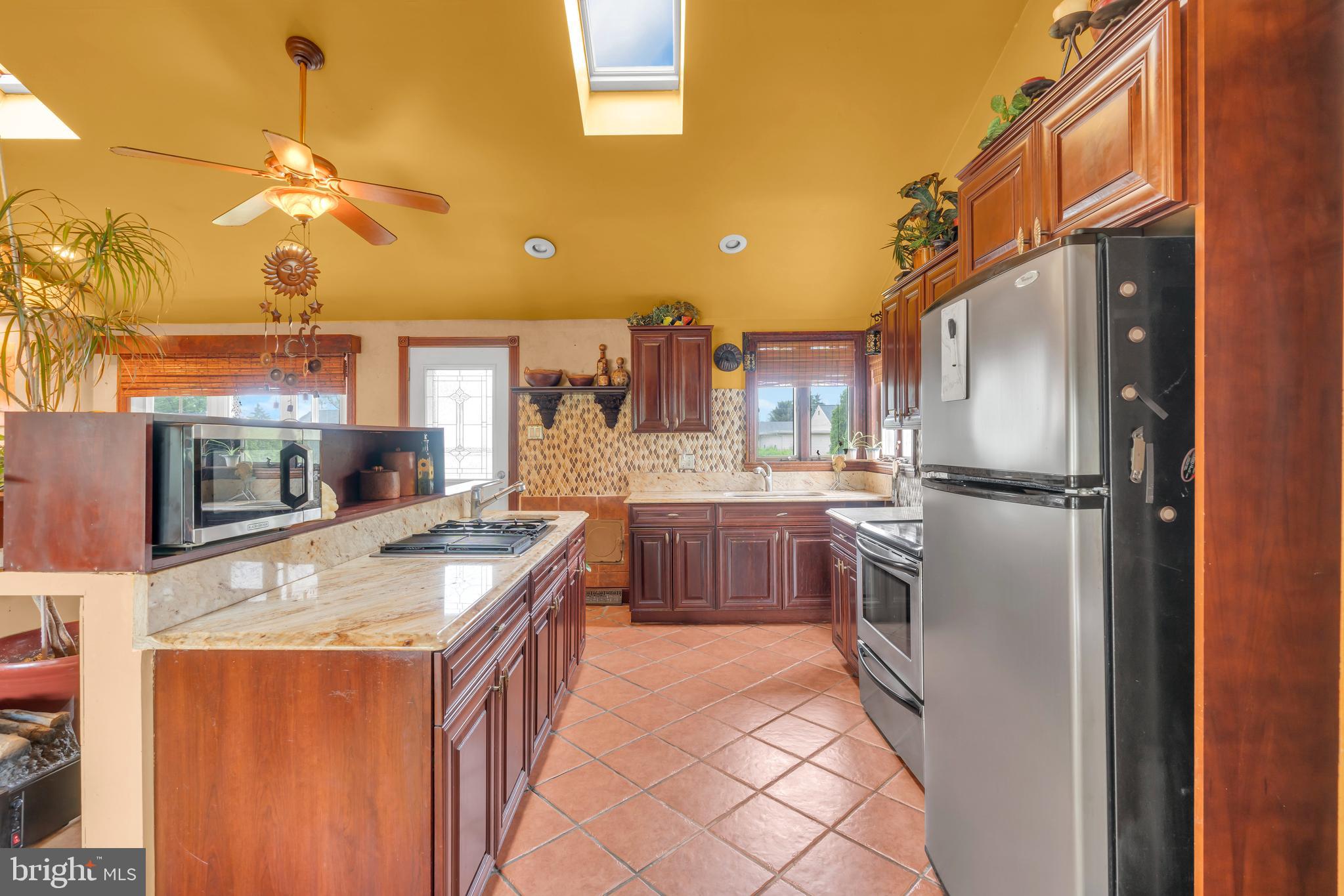 516 River Drive Riverside, NJ 08075 - Photo 13 of 82 a kitchen with stainless steel appliances granite countertop a refrigerator a stove a sink and a microwave