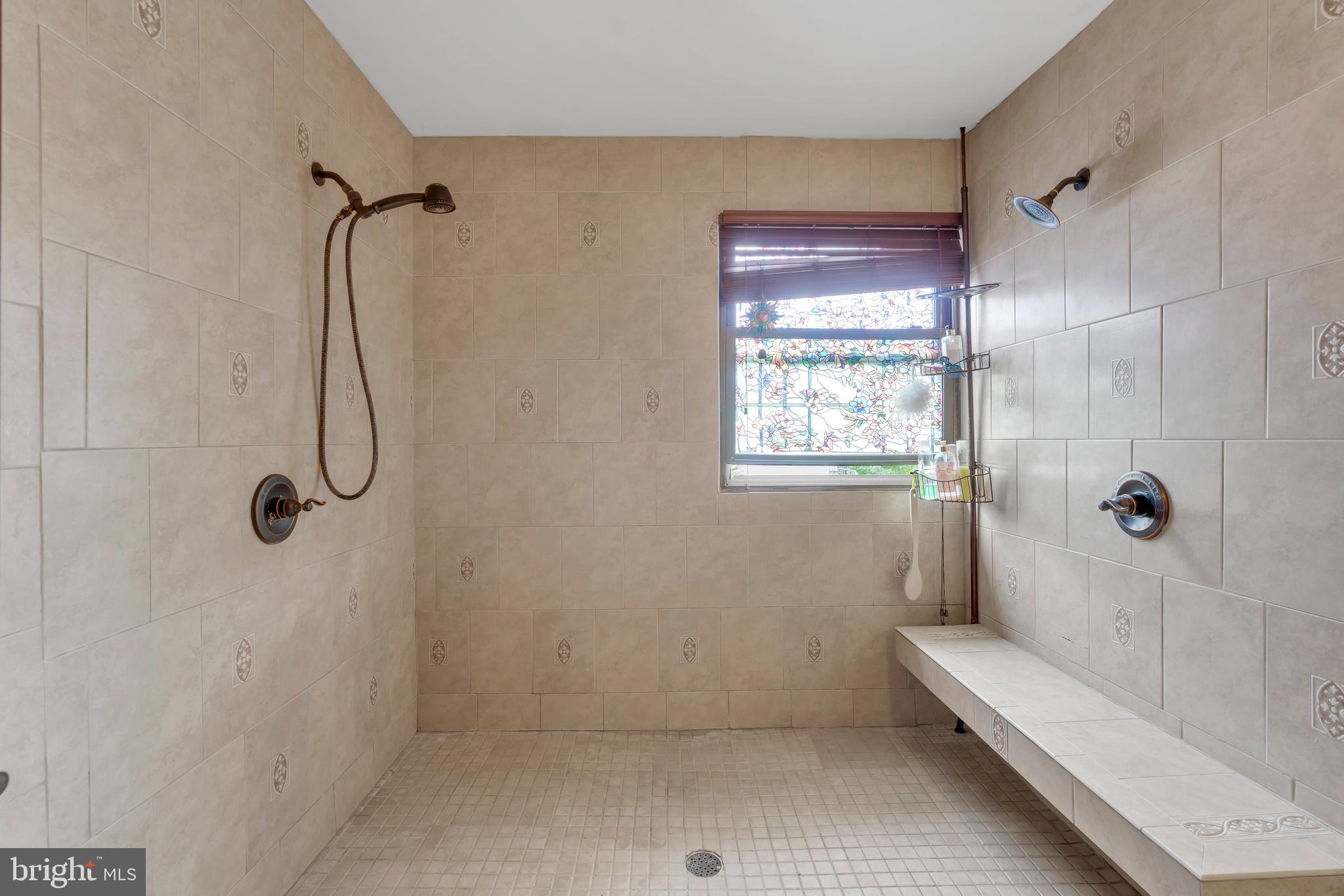 516 River Drive Riverside, NJ 08075 - Photo 22 of 82 a bathroom with a glass shower door