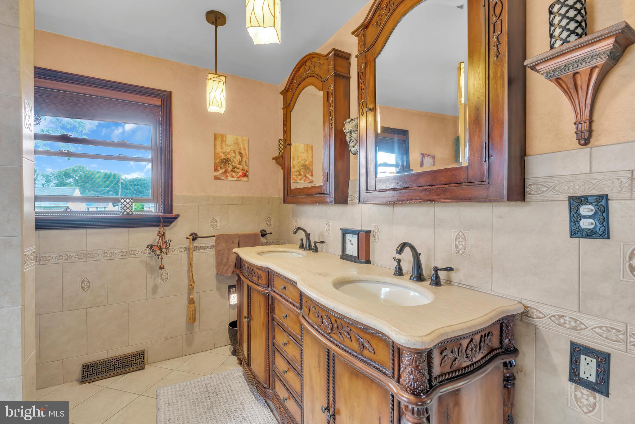 516 River Drive Riverside, NJ 08075 - Photo 23 of 82 a bathroom with a sink and a mirror