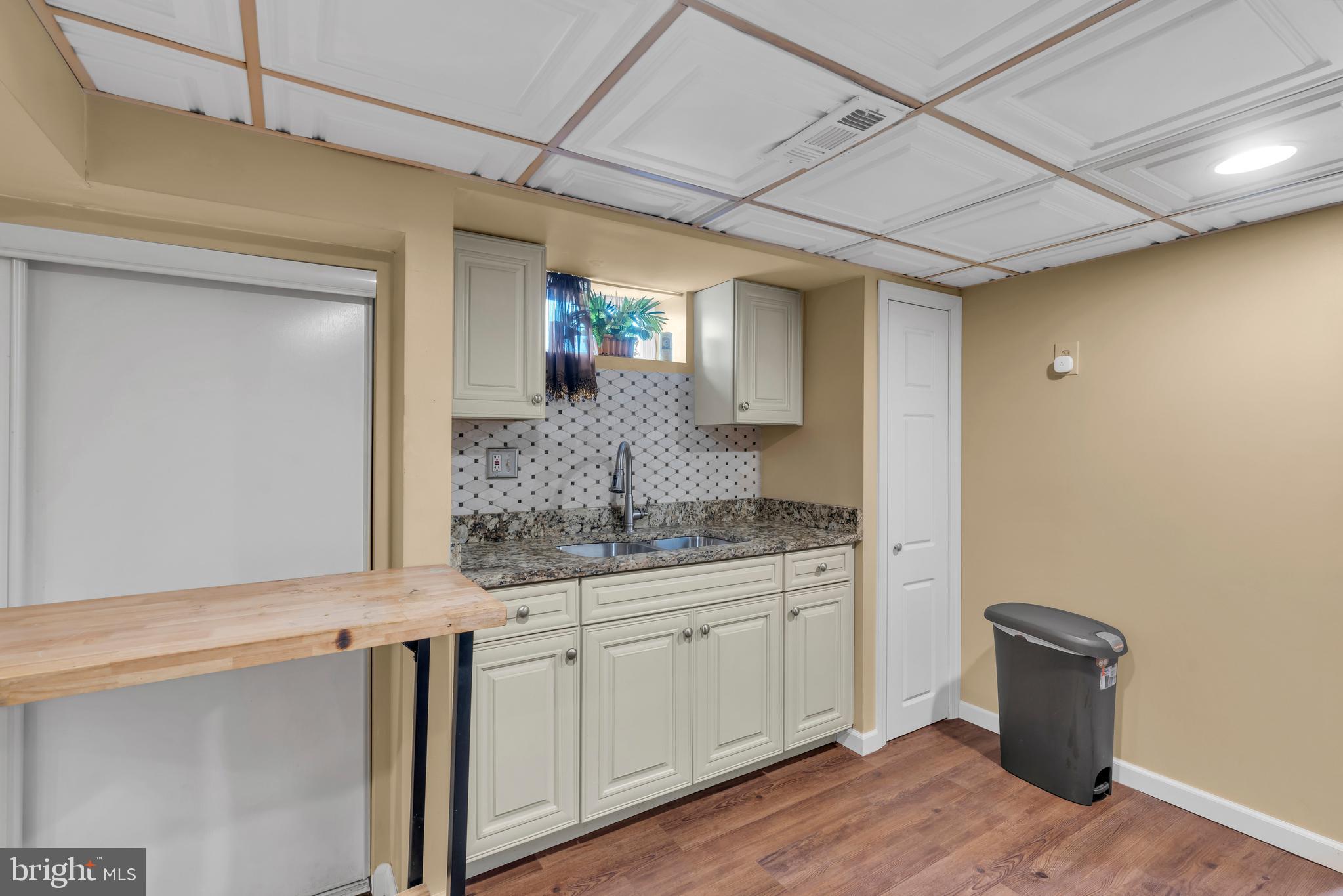 516 River Drive Riverside, NJ 08075 - Photo 36 of 82 a bathroom with a granite countertop sink a mirror and vanity