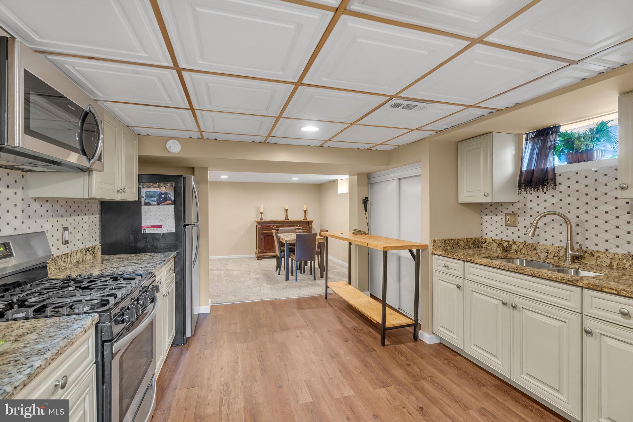 516 River Drive Riverside, NJ 08075 - Photo 37 of 82 a kitchen with stainless steel appliances granite countertop a stove a sink dishwasher and a refrigerator