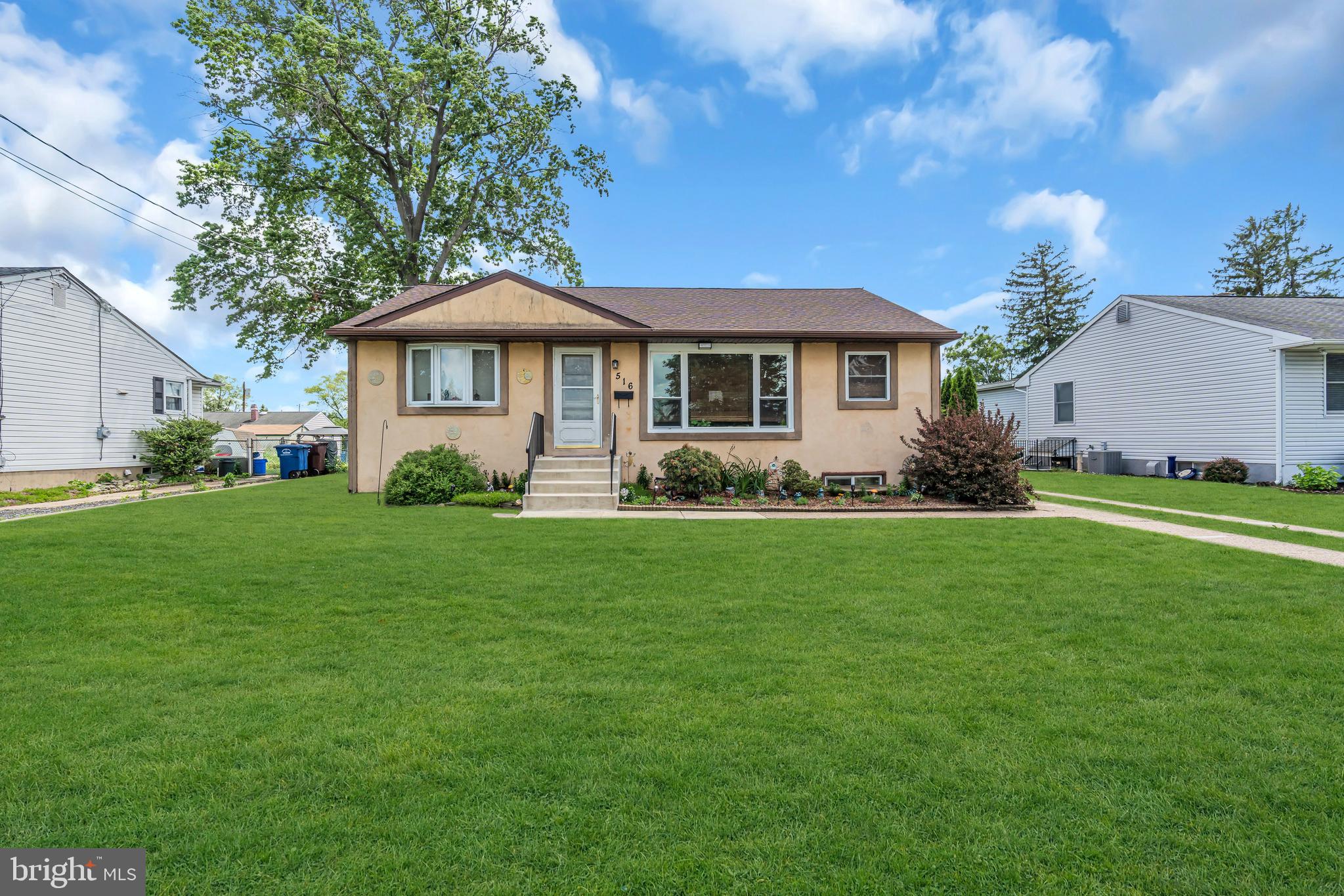 516 River Drive Riverside, NJ 08075 - Photo 51 of 82 a front view of a house with garden