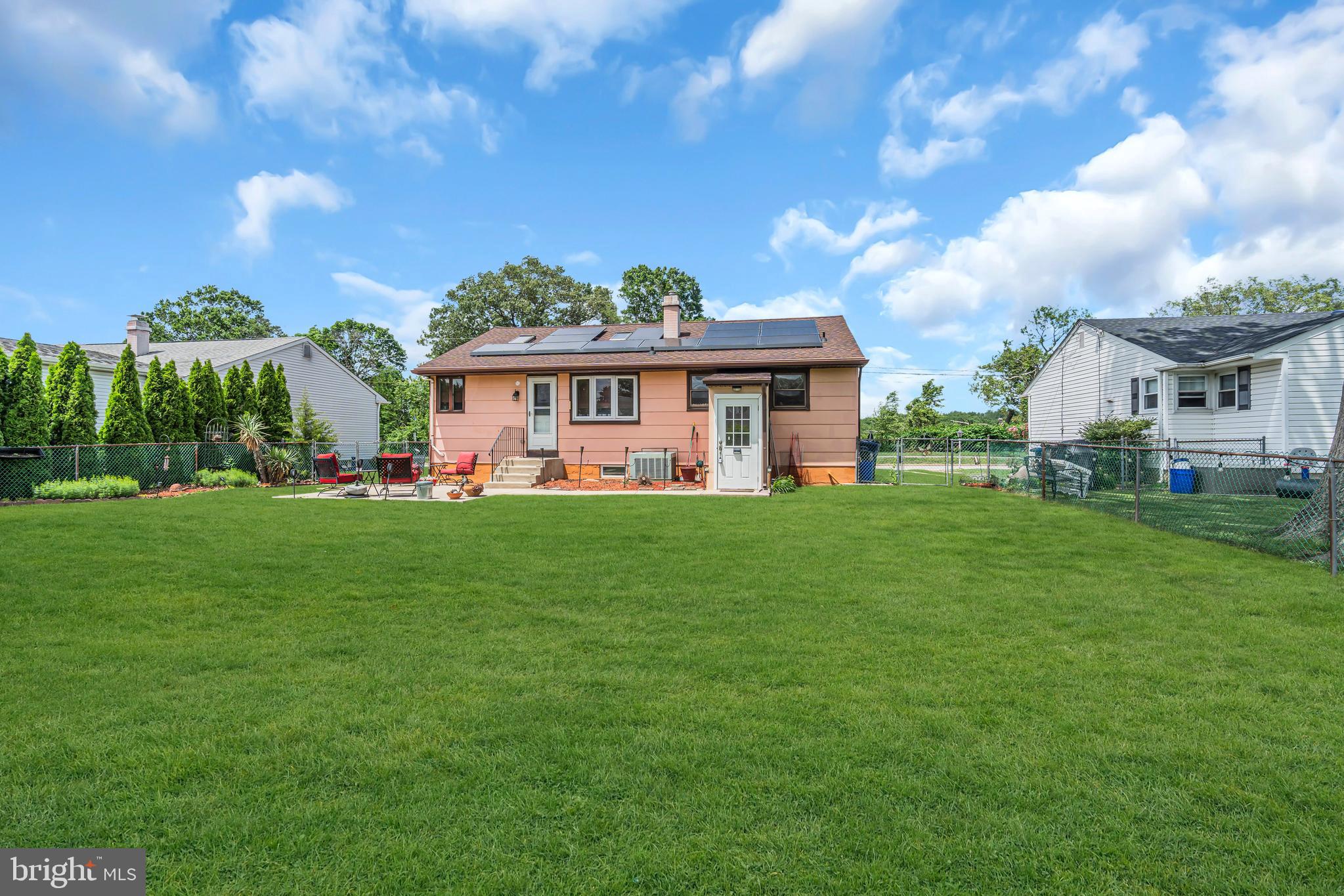 516 River Drive Riverside, NJ 08075 - Photo 61 of 82 a front view of a house with a yard table and chairs