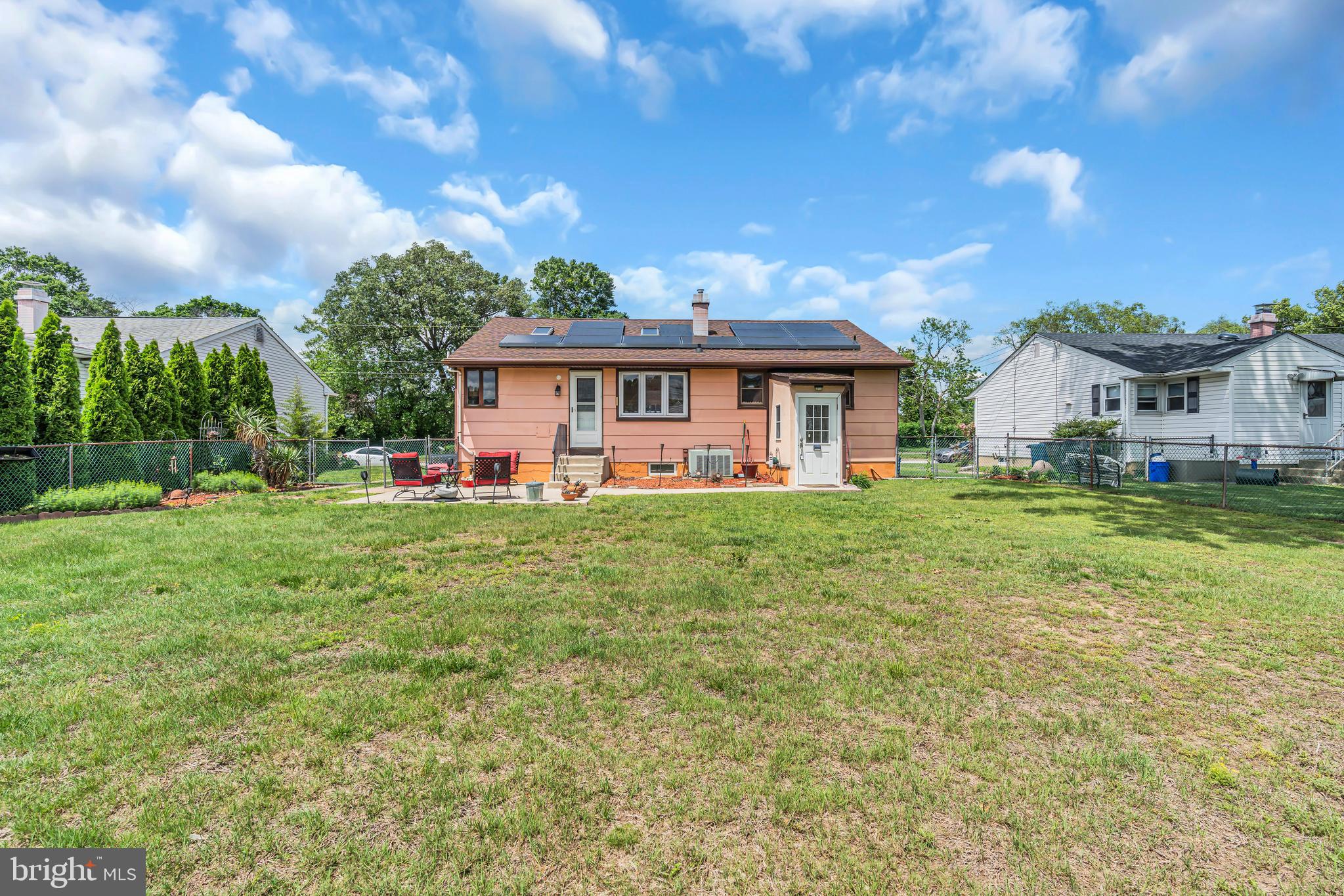 516 River Drive Riverside, NJ 08075 - Photo 76 of 82 a front view of a house with a yard table and chairs