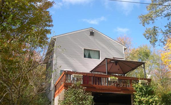 43 Park Road Charlton, MA 01507 - Photo 2 of 26 a view of a house with a yard and balcony
