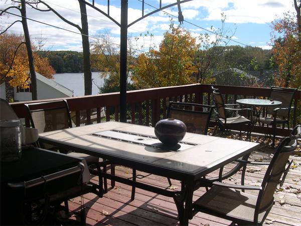 43 Park Road Charlton, MA 01507 - Photo 7 of 26 a view of a balcony with table and chairs