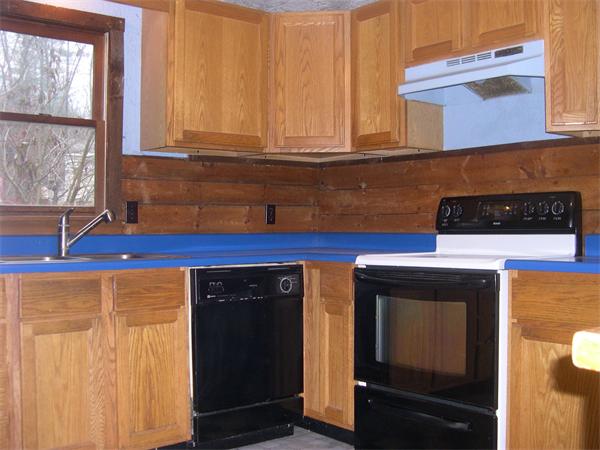 43 Park Road Charlton, MA 01507 - Photo 8 of 26 a kitchen with a sink and cabinets
