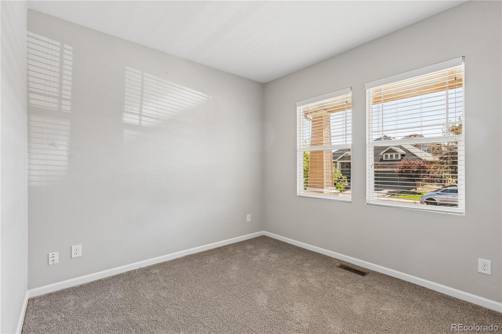 5031 South Rome Street Aurora, CO 80015 - Photo 25 of 39 an empty room with windows